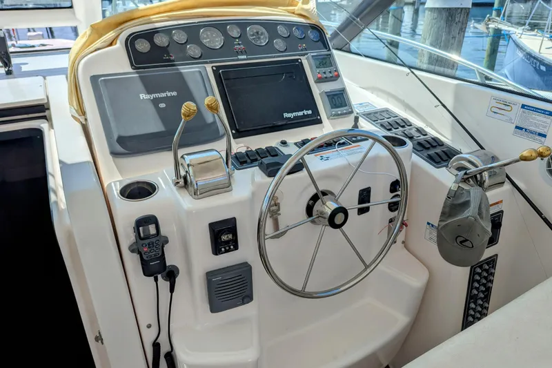 Slide: The Image of Helm of 2007 Tiara Yachts 3600 Sovran with Raymarine navigation system and steering wheel. - 10