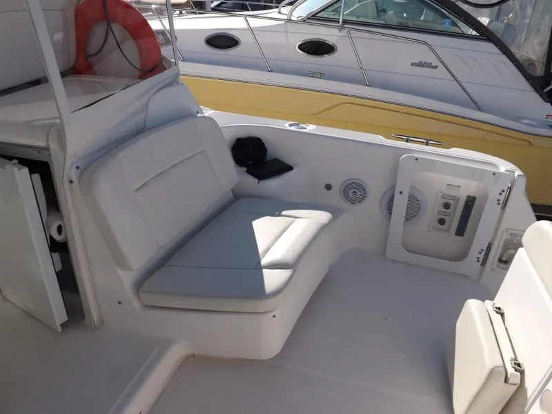 Slide: The Image of 2007 Tiara Yachts 3600 Sovran cockpit with white seating and control panel. - 18