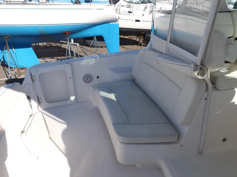 Slide: The Image of 2007 Tiara Yachts 3600 Sovran cockpit with cushioned seating and clean white finish. - 19