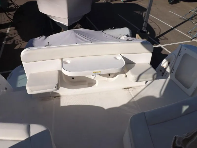 Slide: The Image of 2007 Tiara Yachts 3600 Sovran cockpit with white seating and table. - 20
