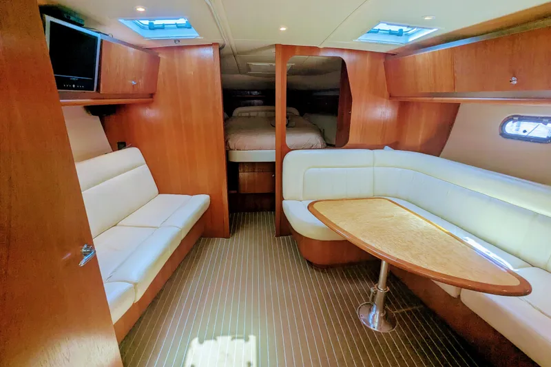 Slide: The Image of Luxurious interior of 2007 Tiara Yachts 3600 Sovran with elegant seating and wood finishes. - 25