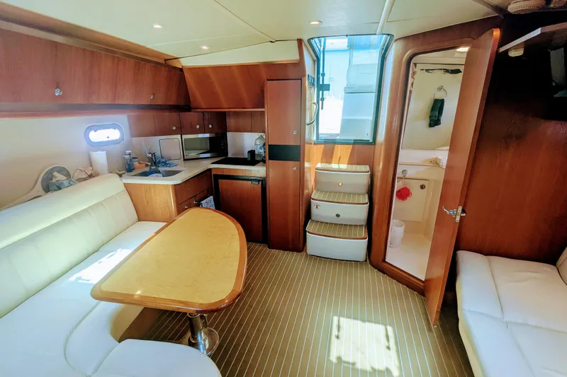 Slide: The Image of Luxurious interior of 2007 Tiara Yachts 3600 Sovran with wood finishes and cozy seating. - 27