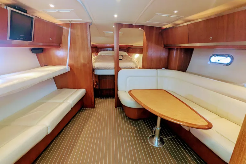 Slide: The Image of Luxurious interior of 2007 Tiara Yachts 3600 Sovran with elegant seating and wood finishes. - 28
