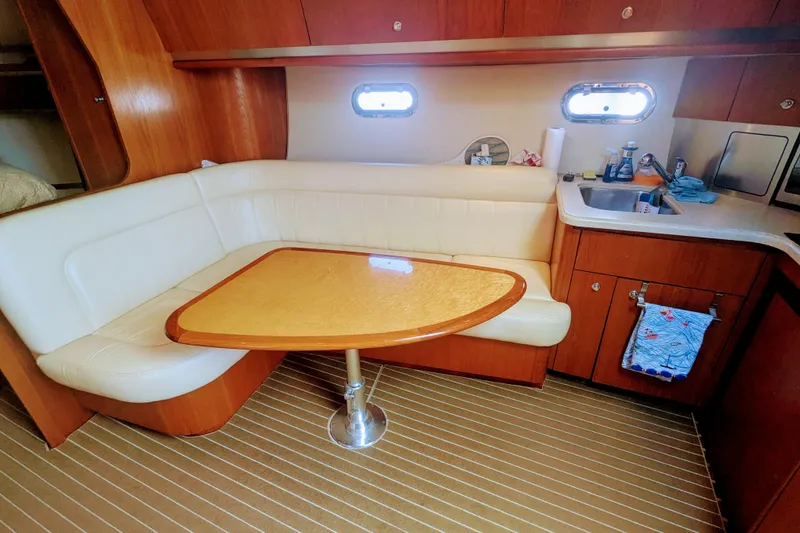 Slide: The Image of 2007 Tiara Yachts 3600 Sovran interior with dining area and kitchenette. - 31