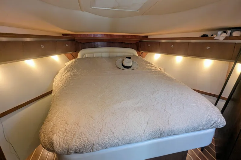Slide: The Image of Luxurious cabin interior of 2007 Tiara Yachts 3600 Sovran with cozy bed and ambient lighting. - 33
