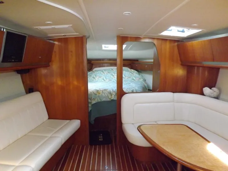 Slide: The Image of 2007 Tiara Yachts 3600 Sovran interior with wood finish and white seating. - 34