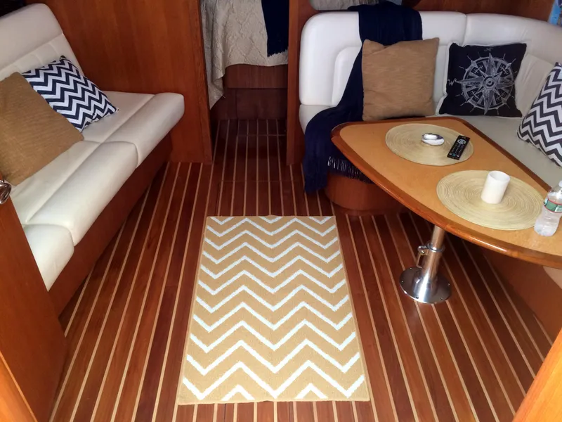 Slide: The Image of Interior of 2007 Tiara Yachts 3600 Sovran with cozy seating and chevron rug. - 35