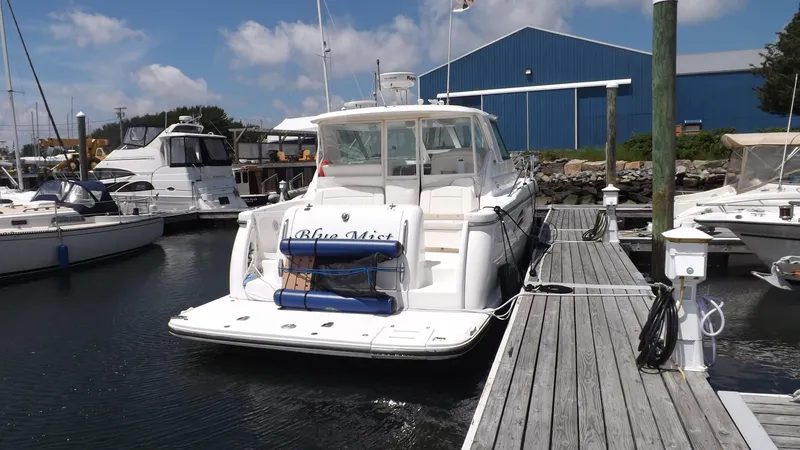Slide: The Image of 2007 Tiara Yachts 3600 Sovran docked at marina, clear sky background. - 5