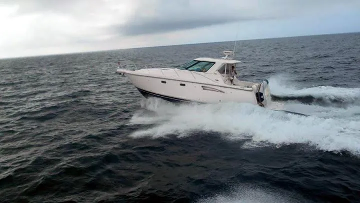 Slide: The Image of 2007 Tiara Yachts 3600 Sovran cruising on open water. - 8