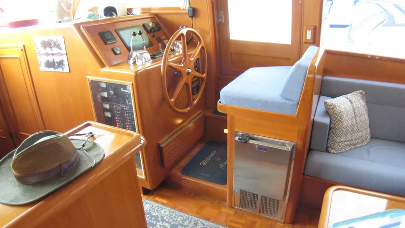 Slide: The Image of Interior of 2003 Ocean Alexander 423 Classicco yacht with helm, seating, and wooden finish. - 14