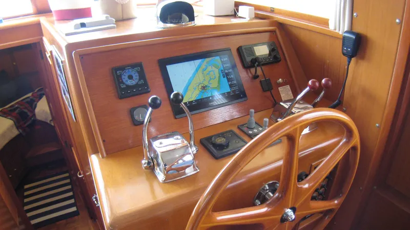 Slide: The Image of Helm of 2003 Ocean Alexander 423 Classicco with navigation equipment and wooden steering wheel. - 15