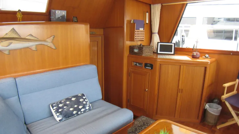 Slide: The Image of Interior of 2003 Ocean Alexander 423 Classicco yacht with wooden cabinetry and blue seating. - 19