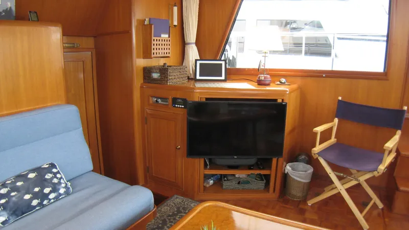 Slide: The Image of Interior of 2003 Ocean Alexander 423 Classicco yacht with cozy seating and entertainment area. - 20