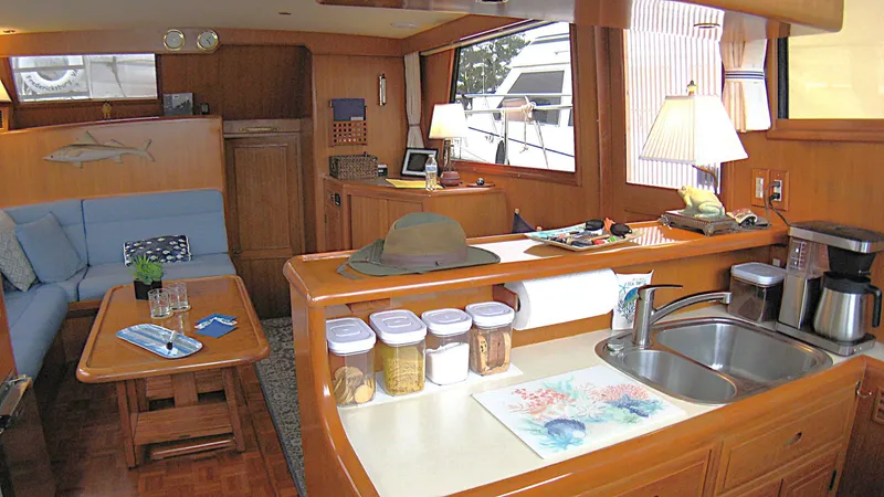 Slide: The Image of Interior of 2003 Ocean Alexander 423 Classicco yacht with cozy seating and kitchen area. - 24