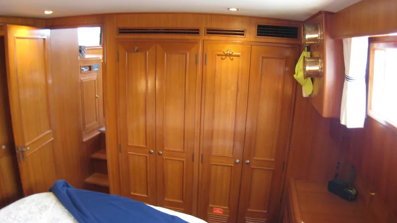 Slide: The Image of Interior of 2003 Ocean Alexander 423 Classicco yacht with wooden cabinetry and cozy design. - 27