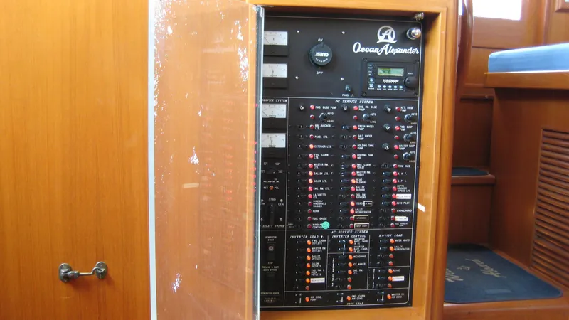 Slide: The Image of Electrical panel inside a 2003 Ocean Alexander 423 Classicco yacht, showcasing controls and switches. - 35