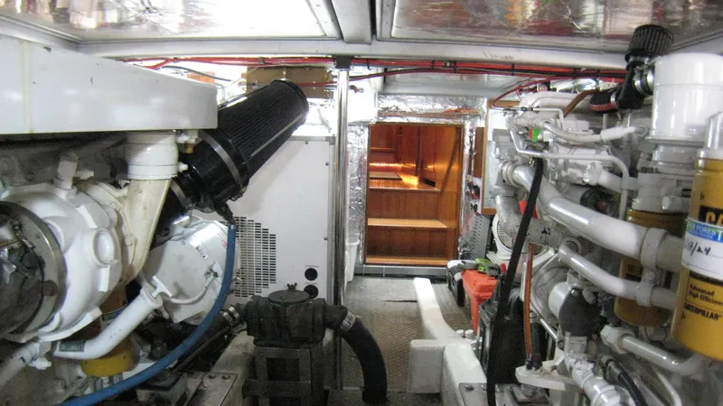 Slide: The Image of Engine room of 2003 Ocean Alexander 423 Classicco yacht, showcasing mechanical components. - 40