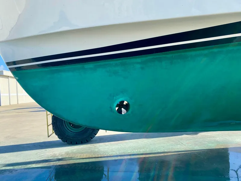 Slide: The Image of 2003 Ocean Alexander 423 Classicco hull with green paint and black stripe detail. - 44