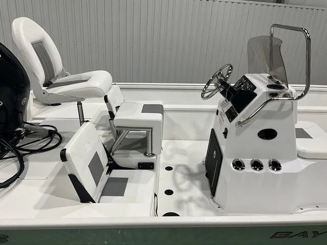 Slide: The Image of 2025 G3 Bay 20 boat interior with seating and steering console. - 8