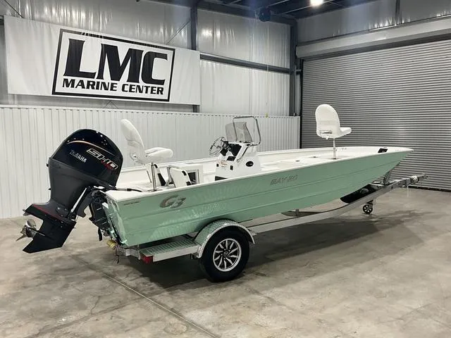 Slide: The Image of 2025 G3 Bay 20 boat in showroom, featuring Yamaha outboard motor. - 9