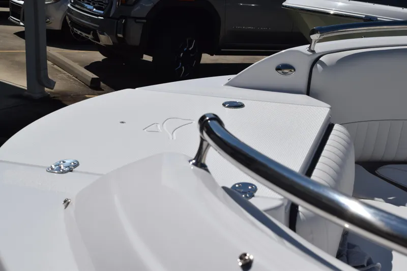 Slide: The Image of 2025 Stingray 211DC boat interior with sleek white seating and chrome details. - 17