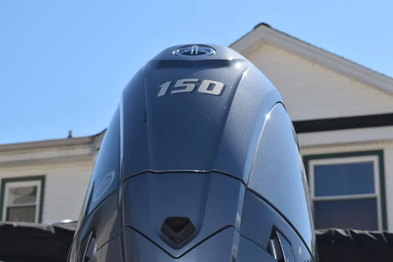 Slide: The Image of Outboard motor on a 2025 Stingray 211DC boat, displaying "150" horsepower. - 6