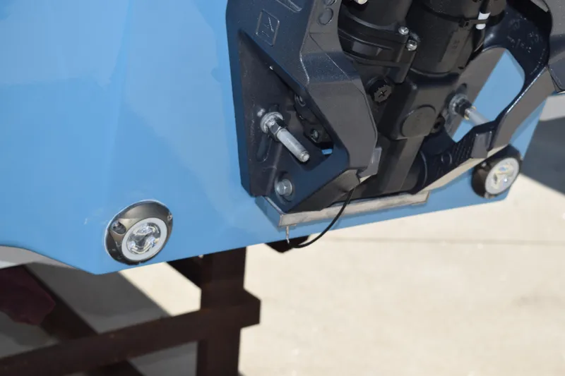 Slide: The Image of 2025 Stingray 211DC boat motor mount detail in blue. - 7