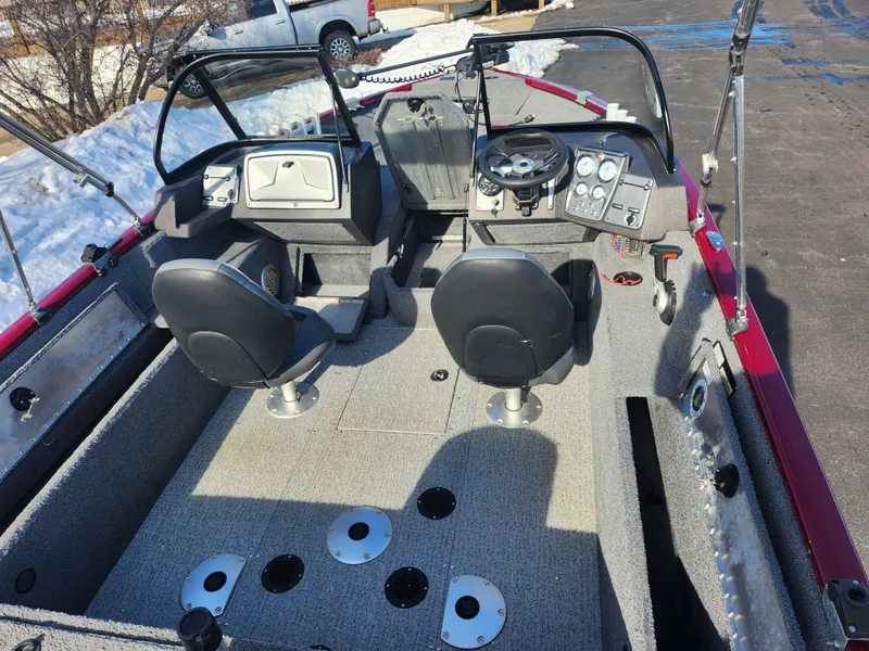 Slide: The Image of 2022 Tracker Pro Guide V-175 WT boat interior with dual seats and control panel. - 11