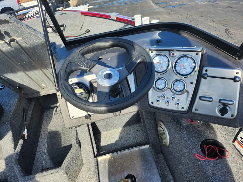 Slide: The Image of 2022 Tracker Pro Guide V-175 WT boat dashboard with steering wheel and gauges. - 14
