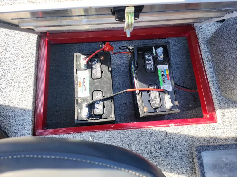 Slide: The Image of 2022 Tracker Pro Guide V-175 WT boat battery compartment with two batteries installed. - 15