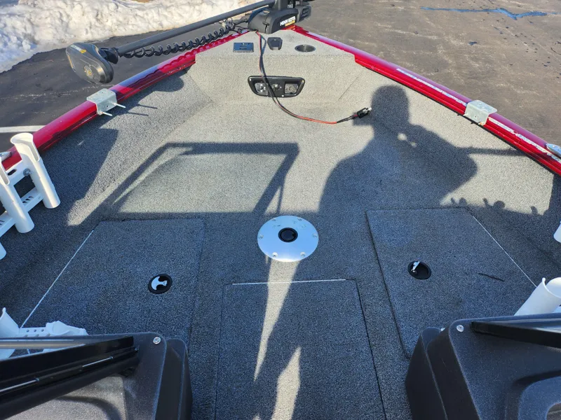 Slide: The Image of 2022 Tracker Pro Guide V-175 WT boat deck with red railing and shadow. - 17