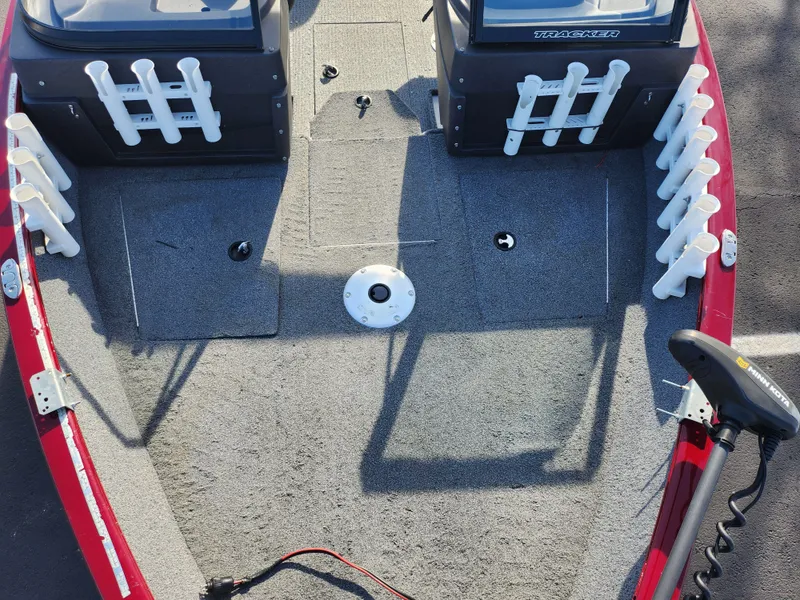 Slide: The Image of 2022 Tracker Pro Guide V-175 WT boat interior with rod holders and trolling motor. - 18