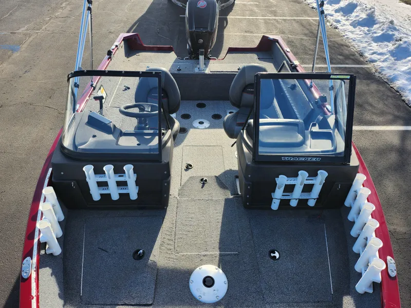 Slide: The Image of 2022 Tracker Pro Guide V-175 WT boat interior with seating and rod holders. - 19
