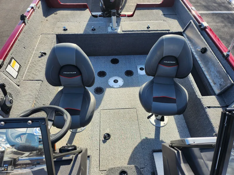 Slide: The Image of 2022 Tracker Pro Guide V-175 WT boat interior with two seats and steering wheel. - 20