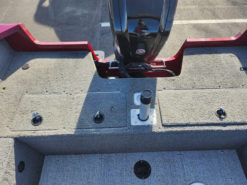 Slide: The Image of 2022 Tracker Pro Guide V-175 WT boat interior with carpeted deck and motor mount. - 22