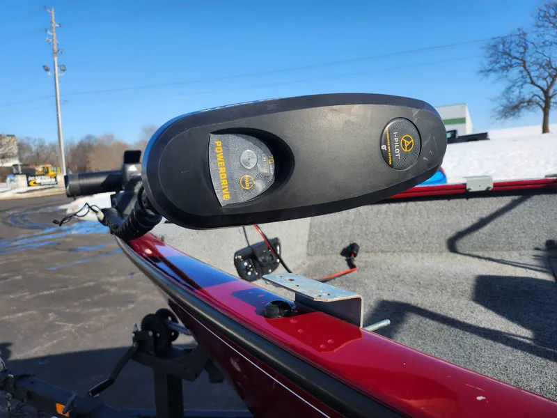 Slide: The Image of 2022 Tracker Pro Guide V-175 WT boat with trolling motor, red exterior, parked outdoors. - 6