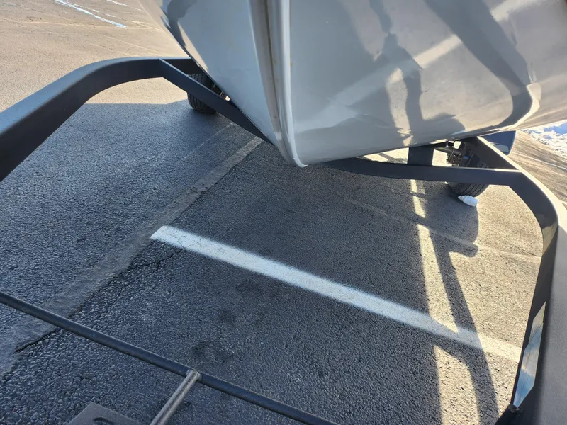 Slide: The Image of 2022 Tracker Pro Guide V-175 WT boat on trailer, parked on asphalt. - 8