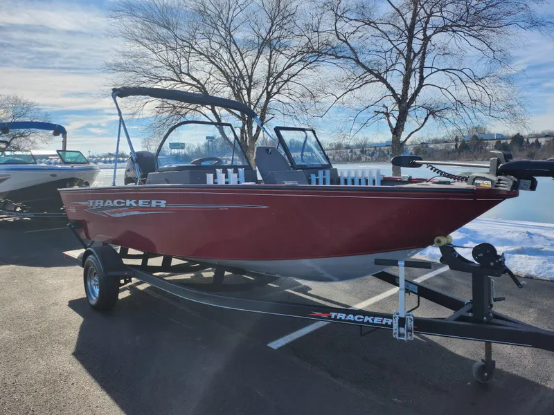 Slide: The Image of 2022 Tracker Pro Guide V-175 WT boat on trailer, parked near a lake. - 9
