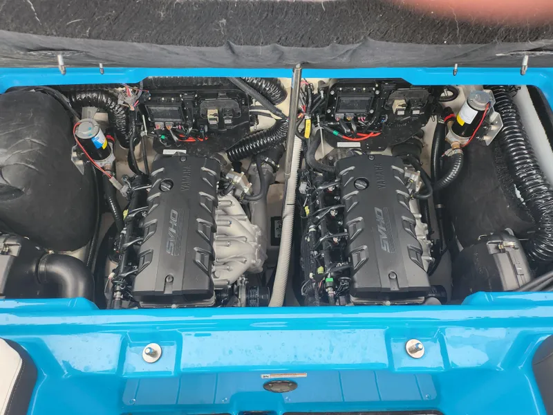 Slide: The Image of 2022 Yamaha Boats 255XD engine compartment with dual engines and wiring. - 21
