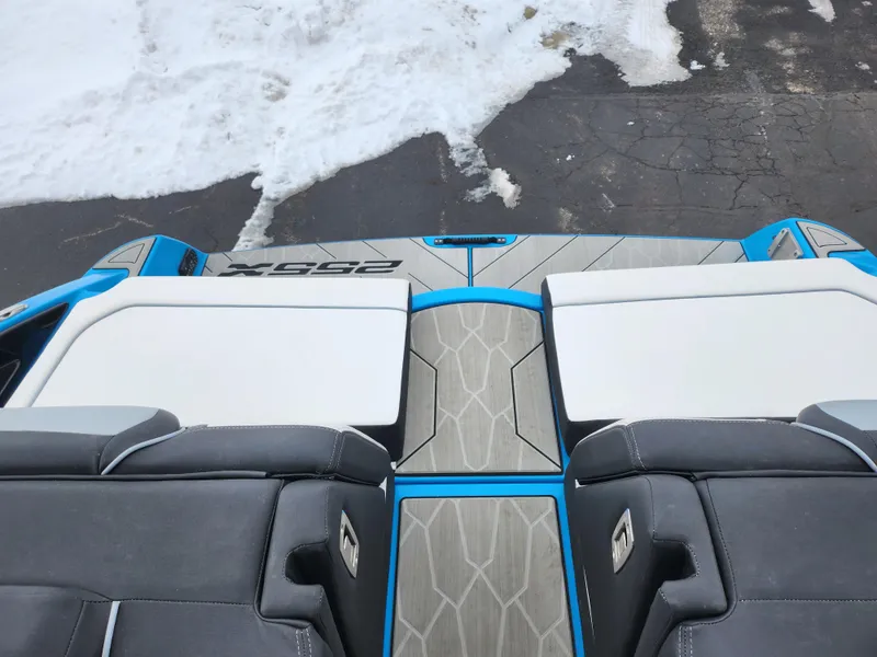 Slide: The Image of 2022 Yamaha Boats 255XD interior with sleek seating and modern design. - 23