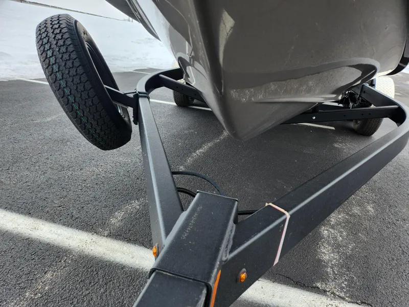 Slide: The Image of Yamaha Boats 2022 255XD on trailer, close-up of hull and wheel. - 7