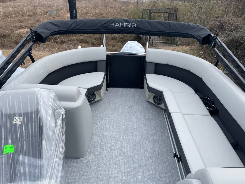 Slide: The Image of 2025 Harris Cruiser 210 pontoon boat interior with gray seating and canopy. - 5