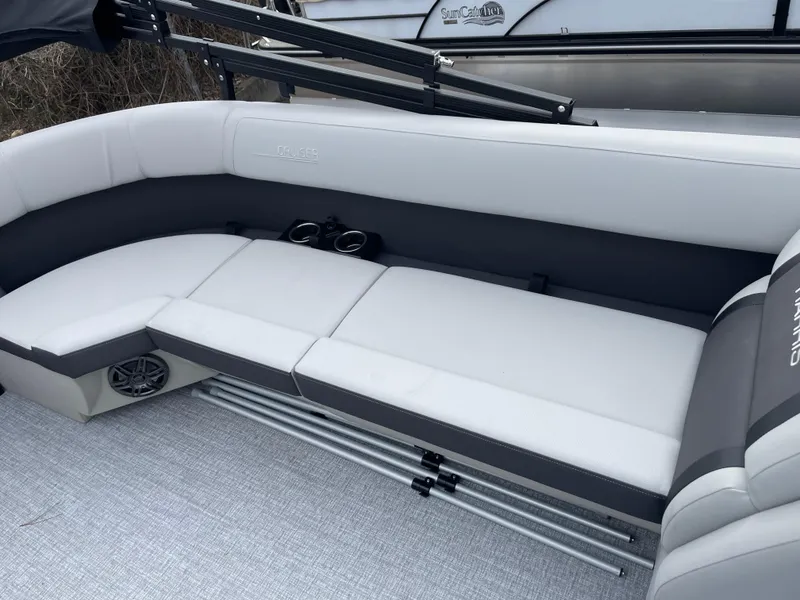 Slide: The Image of 2025 Harris Cruiser 210 boat interior with gray seating and cup holders. - 6