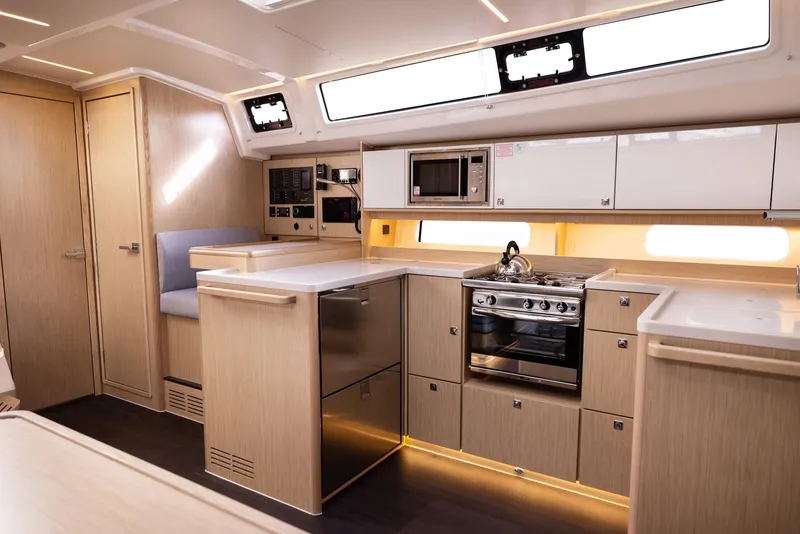 Slide: The Image of Modern kitchen interior of 2025 Bavaria C46 yacht with sleek cabinetry and appliances. - 12