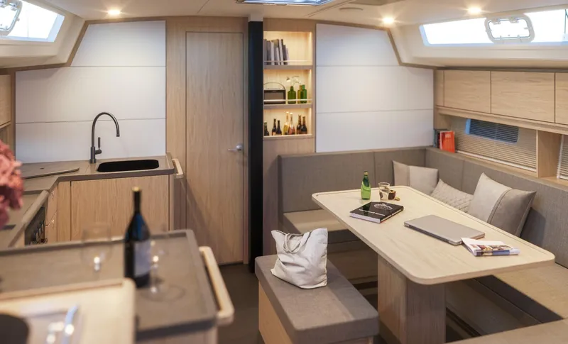 Slide: The Image of Luxurious interior of 2025 Bavaria C46 yacht with modern kitchen and dining area. - 13