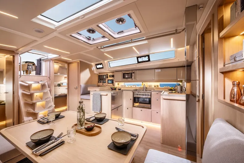 Slide: The Image of Luxurious interior of 2025 Bavaria C46 yacht, featuring modern kitchen and dining area. - 5