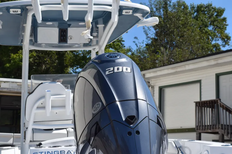 Slide: The Image of 2025 Stingray 216CC boat with powerful 200 horsepower engine, outdoor setting. - 3