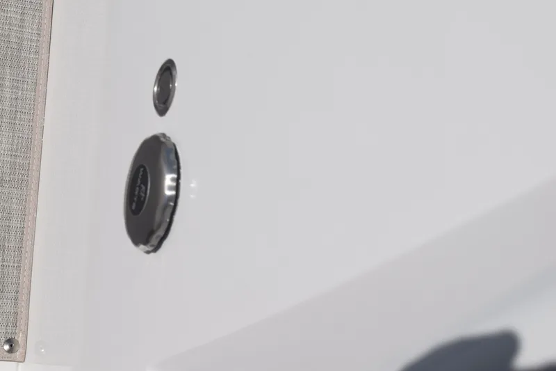 Slide: The Image of Close-up of 2025 Stingray 216CC boat detail, featuring sleek white surface and fittings. - 32