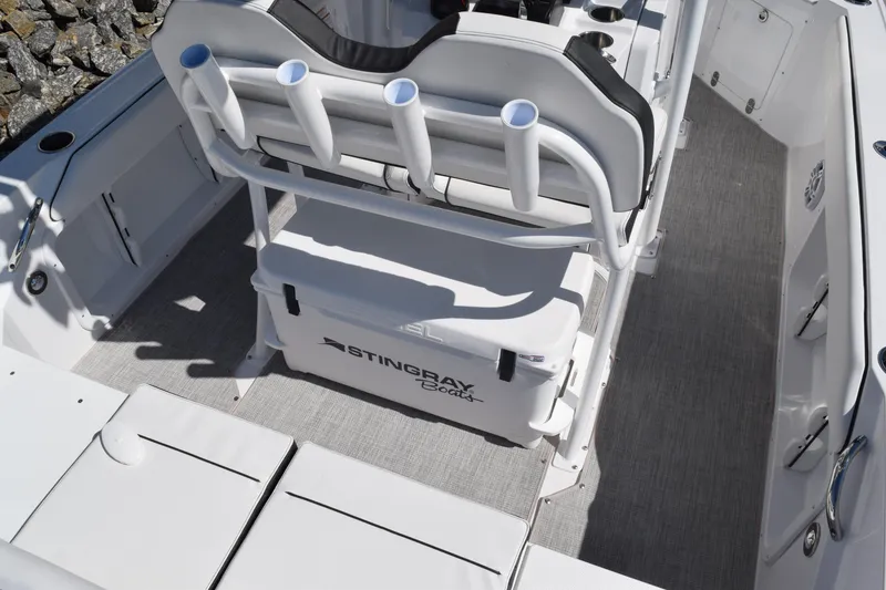 Slide: The Image of 2025 Stingray 216CC boat interior with rod holders and seating. - 35