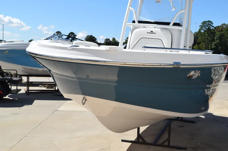 Slide: The Image of 2025 Stingray 216CC boat on display, featuring sleek design and modern features. - 5
